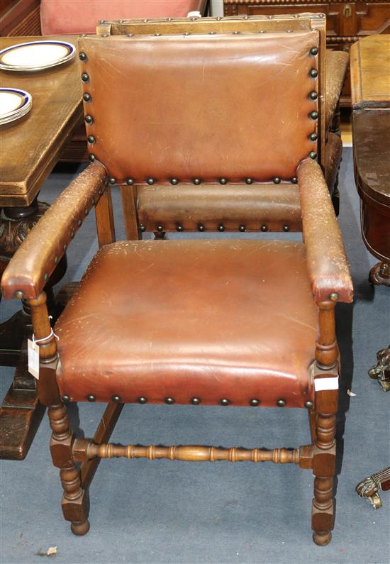A set of eight Cromwellian style oak dining chairs, with brown leather upholstery